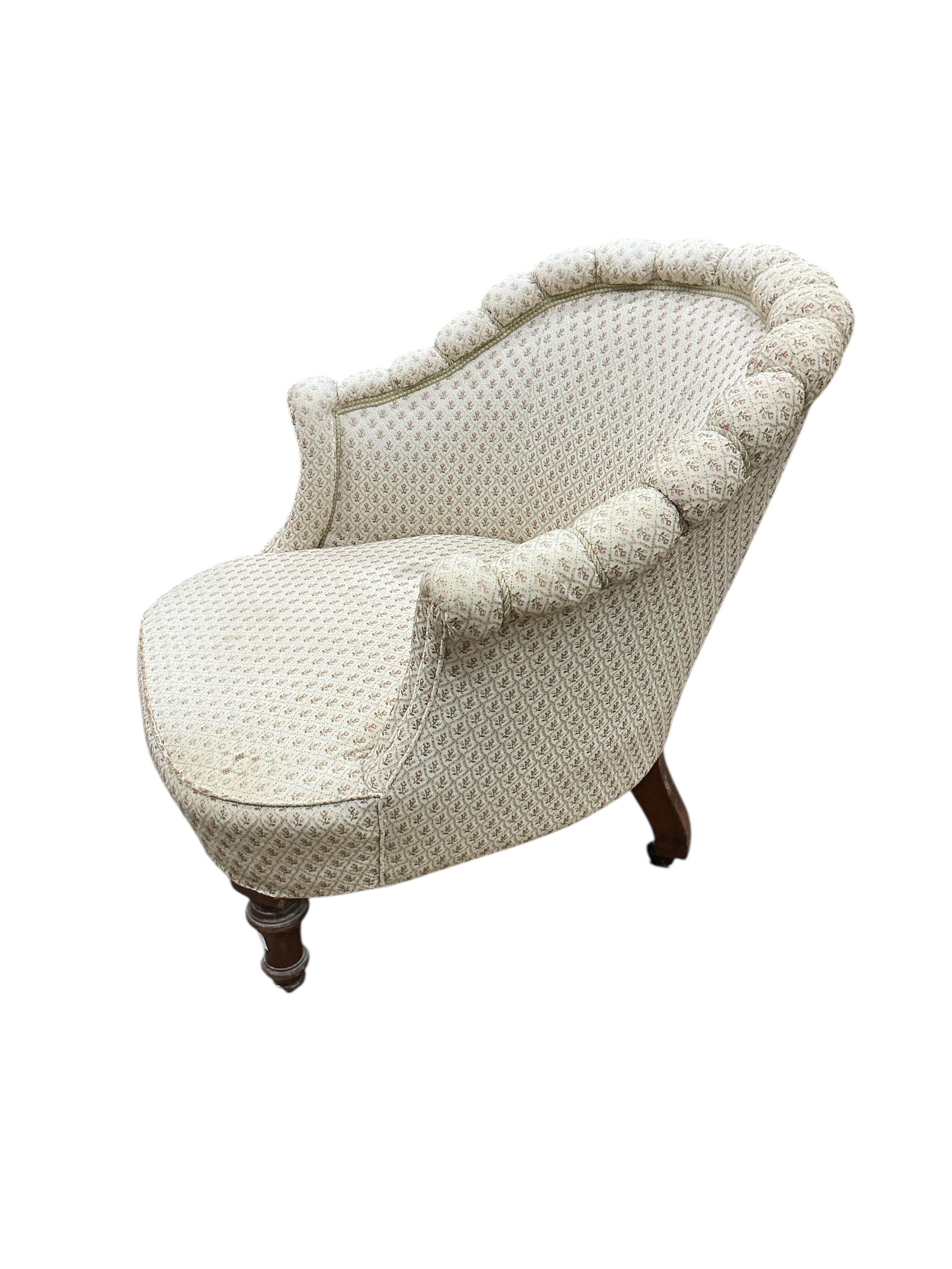 An early Victorian upholstered armchair, width 74cm, depth 76cm, height 74cm